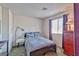 Comfortable bedroom featuring neutral walls, carpet and a bed with plush bedding, plus natural light at 101 Morning Dr, Henderson, NV 89012
