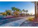 Community entrance featuring palm trees and distinctive signage for 'Sonoma' at 101 Morning Dr, Henderson, NV 89012