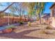Scenic community grounds with mature trees, rock features and charming landscaping at 101 Morning Dr, Henderson, NV 89012