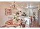 Warm dining room features chandelier, dining table and access to kitchen at 101 Morning Dr, Henderson, NV 89012