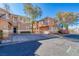 Well-maintained two-story home with a stucco exterior, large driveway and mature landscaping at 101 Morning Dr, Henderson, NV 89012
