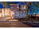 Night view of home with two-car garage and manicured front yard at 101 Morning Dr, Henderson, NV 89012