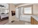 Bathroom featuring a shower, tub, and access to a bedroom at 10457 Raining Sky St, Las Vegas, NV 89178