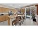 Spacious kitchen with a large island, stainless steel appliances, and sliding doors to the outdoor patio at 10457 Raining Sky St, Las Vegas, NV 89178