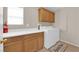 Laundry room with washer, dryer, and cabinets at 10457 Raining Sky St, Las Vegas, NV 89178