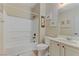 Bright bathroom featuring a tub and shower combination with white cabinets and neutral walls at 1053 Hickory Park St, Las Vegas, NV 89138