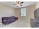 Cozy bedroom with a futon, side table, and a TV, creating a relaxing and functional space at 1053 Hickory Park St, Las Vegas, NV 89138