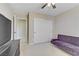 Cozy bedroom with a futon, closet, and a TV, creating a relaxing and functional space at 1053 Hickory Park St, Las Vegas, NV 89138