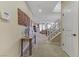 Inviting entryway featuring neutral colors, a staircase, and access to the living and dining areas at 1053 Hickory Park St, Las Vegas, NV 89138