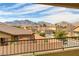 Scenic neighborhood view showcasing beautiful homes against a stunning mountain backdrop, creating a picturesque setting at 1053 Hickory Park St, Las Vegas, NV 89138