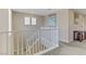 Upstairs hallway with carpet flooring and white railing showing access to different rooms at 1053 Hickory Park St, Las Vegas, NV 89138