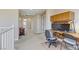 Bright hallway with desk, office space, carpet flooring, and neutral walls at 1053 Hickory Park St, Las Vegas, NV 89138