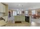 Open concept kitchen features a kitchen island, appliances, and easy access to living and dining areas at 1053 Hickory Park St, Las Vegas, NV 89138