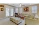Spacious living room with lots of natural light showcases neutral tones and comfortable seating at 1053 Hickory Park St, Las Vegas, NV 89138