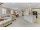 Open floorplan features the living room, dining area, and kitchen with a staircase to the upper level at 1053 Hickory Park St, Las Vegas, NV 89138