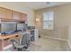 Comfortable office space featuring built-in cabinets and a large window for natural light at 1053 Hickory Park St, Las Vegas, NV 89138