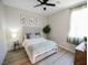 Bright bedroom features a ceiling fan, stylish decor, and lots of natural light at 1122 Brilliant Meadow Ave, North Las Vegas, NV 89086