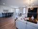 Expansive living area with a dining table, comfortable seating, and modern decor at 1122 Brilliant Meadow Ave, North Las Vegas, NV 89086