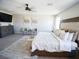 Well-appointed main bedroom with a large bed, TV, and ample natural light at 1122 Brilliant Meadow Ave, North Las Vegas, NV 89086