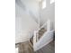 Modern staircase with white railings and wood steps leads to the upper level at 1122 Brilliant Meadow Ave, North Las Vegas, NV 89086