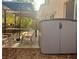 Outdoor patio space featuring dining set, umbrella, and a Suncast storage shed at 1463 Evening Song Ave, Henderson, NV 89012
