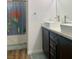 Bathroom featuring double sinks and a shower with a colorful curtain at 1463 Evening Song Ave, Henderson, NV 89012