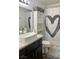 Modern bathroom showcasing a stylish sink, decorative shower curtain, and ample shelving at 1463 Evening Song Ave, Henderson, NV 89012