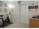 Neutral bedroom featuring an exercise bike and minimalist decor at 1463 Evening Song Ave, Henderson, NV 89012