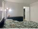 Bedroom featuring a bed, dresser, and access to a walk-in closet at 1463 Evening Song Ave, Henderson, NV 89012