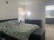 Comfortable bedroom featuring a bed, dresser, and access to a bathroom at 1463 Evening Song Ave, Henderson, NV 89012