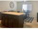 Dining room features a large island with light countertop and seating for four at the table at 1463 Evening Song Ave, Henderson, NV 89012