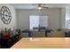 Bright dining room area featuring a table and chairs with a large clock on the wall at 1463 Evening Song Ave, Henderson, NV 89012