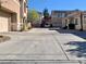 Long driveway and multiple townhome exteriors, offering parking and community views at 1463 Evening Song Ave, Henderson, NV 89012