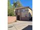 Spacious two-story home featuring a neutral color palette and well-manicured front yard and driveway at 1463 Evening Song Ave, Henderson, NV 89012