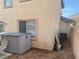 Home's exterior with a utility storage container, landscaping, and the building's architectural design features at 1463 Evening Song Ave, Henderson, NV 89012