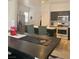 Modern kitchen featuring stainless steel appliances and dark cabinets, ideal for cooking and entertaining at 1463 Evening Song Ave, Henderson, NV 89012