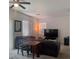 Cozy living room with neutral walls, window blinds, a ceiling fan, and comfortable seating at 1463 Evening Song Ave, Henderson, NV 89012