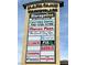 Mahacamu Marketplace signage featuring StorageOne, Crestview Dental, Marco's Pizza, and other business listings at 1463 Evening Song Ave, Henderson, NV 89012