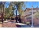 Tree-lined street with sidewalks and decorative streetlights, enhancing the neighborhood's charm and walkability at 1463 Evening Song Ave, Henderson, NV 89012