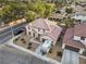 Aerial view showcasing the home's exterior, landscaping, and neighborhood surroundings at 1495 Le Luberon Ct, Las Vegas, NV 89123
