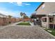 Large backyard with a pergola, artificial turf, and easy to maintain desert landscaping at 1495 Le Luberon Ct, Las Vegas, NV 89123