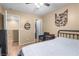 Spacious bedroom with wooden floors, chair, dresser, and bright lighting at 1495 Le Luberon Ct, Las Vegas, NV 89123