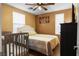 Comfortable bedroom with two beds and natural lighting at 1495 Le Luberon Ct, Las Vegas, NV 89123