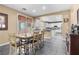 Cozy dining area featuring granite table, seating for six, and bright lighting at 1495 Le Luberon Ct, Las Vegas, NV 89123