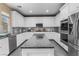 Bright kitchen featuring stainless steel appliances and a granite island at 1495 Le Luberon Ct, Las Vegas, NV 89123