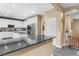 Modern kitchen with white cabinets, stainless appliances, and granite island at 1495 Le Luberon Ct, Las Vegas, NV 89123