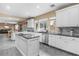 Spacious kitchen featuring a granite-topped island and stainless steel appliances at 1495 Le Luberon Ct, Las Vegas, NV 89123