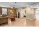 Spacious living room featuring wood floors, ceiling fan and doorways to adjoining rooms at 1495 Le Luberon Ct, Las Vegas, NV 89123