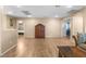 Inviting living room with open space, light wood flooring, and doorways to adjoining bedrooms at 1495 Le Luberon Ct, Las Vegas, NV 89123