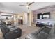 Open-concept living area with plank accent wall and easy access to dining at 1495 Le Luberon Ct, Las Vegas, NV 89123